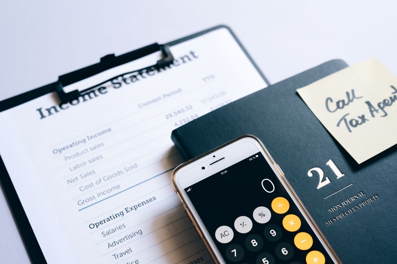 Home Close-up of income statement, calculator, and planner for financial planning.